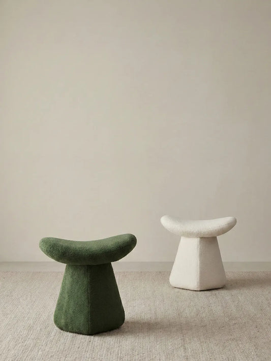 Comparison of the Cumberland mushroom stool in Moss Green and Cream White bouclé, highlighting color options for different interior styles.