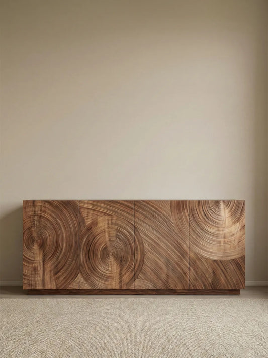 Angled view of the Curator sideboard with a door open, revealing spacious interior shelving and the thick solid wood door construction.