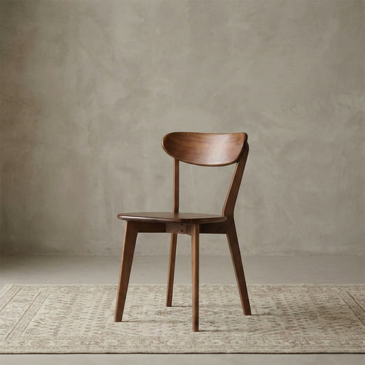 Studio shot of the Sylva chair in North American Black Walnut, isolated on a neutral background.