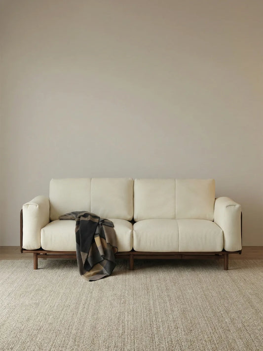 Walnutry minimalist 2-seater sofa upholstered in cream textured fabric, supported by a solid North American black walnut wood frame and legs.