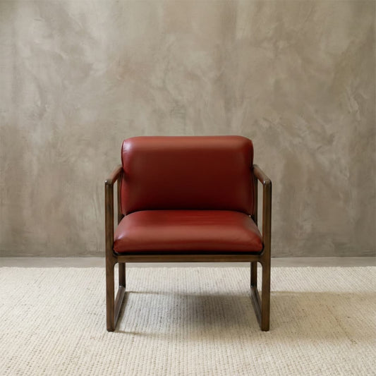 Modern luxury armchair featuring rust-colored genuine leather and a robust solid black walnut wood frame, ideal for living room lounge areas.