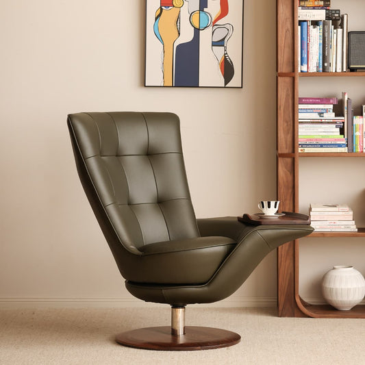 Modern olive green leather swivel lounge chair with walnut wood base and built-in arm tray in minimalist room