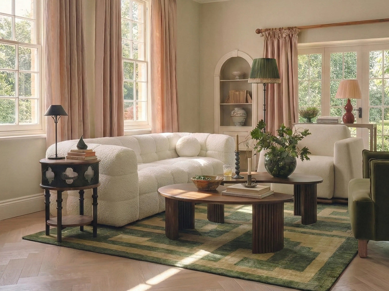 Modern living room with curvy cream sofa, two brown armchairs, wooden coffee table, and walnut sideboard