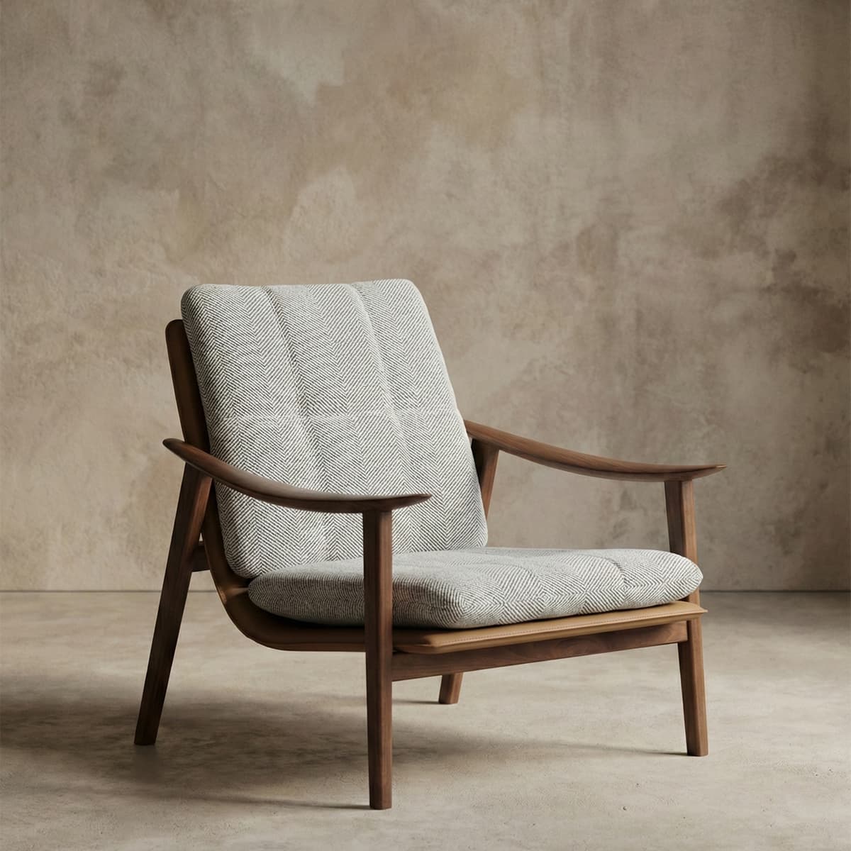 Mid-century modern lounge chair with solid black walnut frame and textured beige cushion in minimalist room