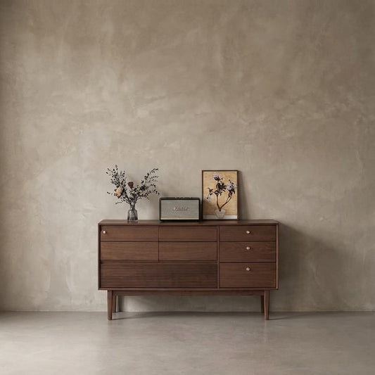 Mid-century modern solid North American black walnut sideboard with vase, vintage speaker, and floral artwork