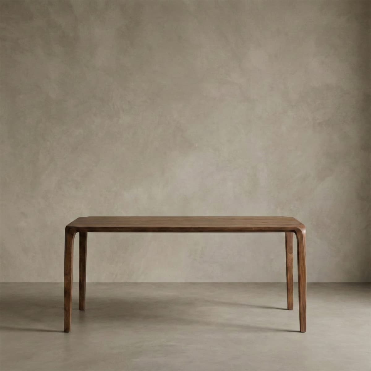 Heirloom-quality North American Black Walnut dining table with curved legs in minimalist room