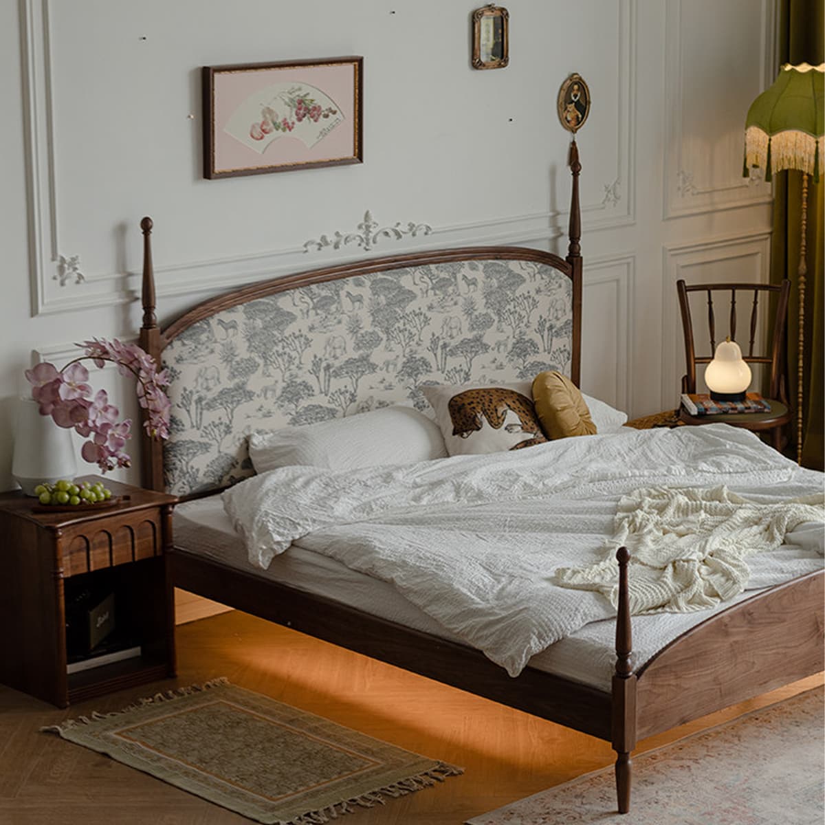 Solid North American Black Walnut bed with patterned fabric headboard, white bedding, and vintage bedroom decor