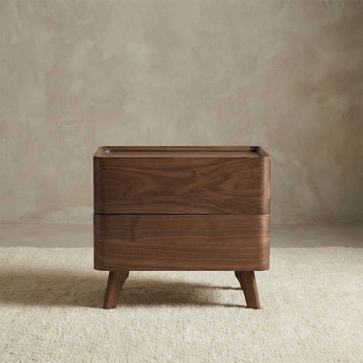 Minimalist solid North American black walnut wooden nightstand with rounded edges on cream rug