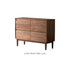 Modern 6-drawer double dresser made of solid walnut featuring geometric carved details.