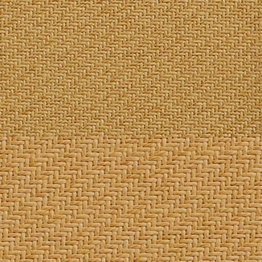 Close-up of beige woven fabric with intricate herringbone pattern, emphasizing texture and craftsmanship