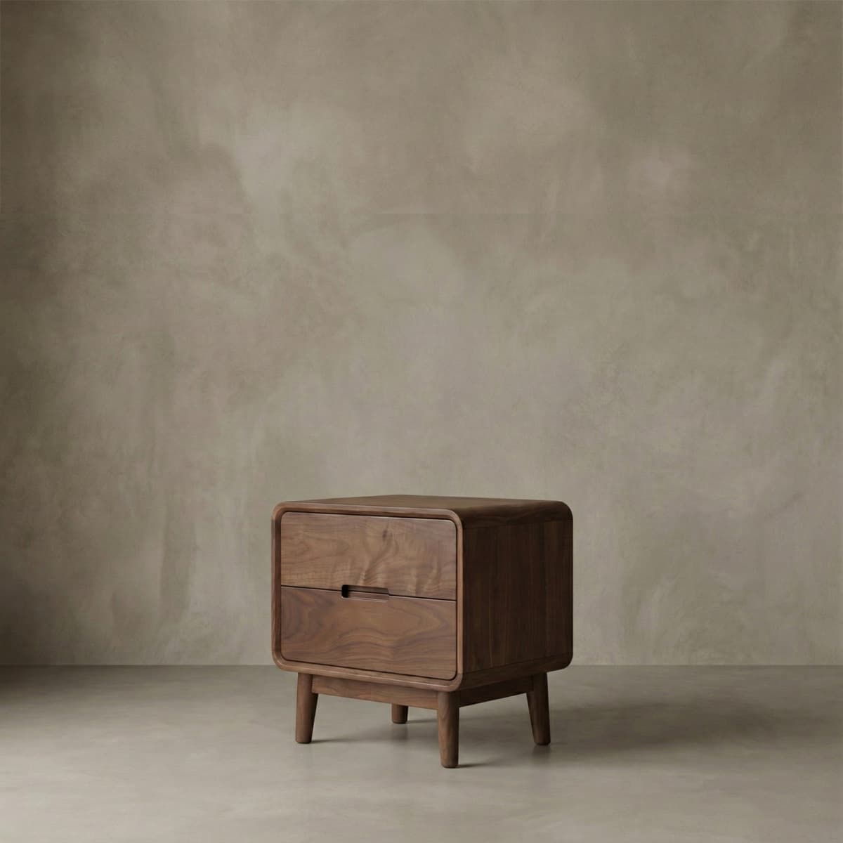 Solid North American Black Walnut nightstand with two drawers and rounded edges in minimalist setting