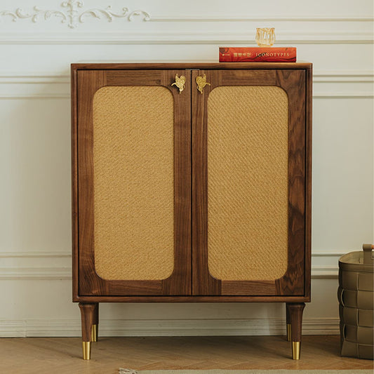 Solid North American Black Walnut cabinet with woven rattan doors, brass hardware, and decorative book on top