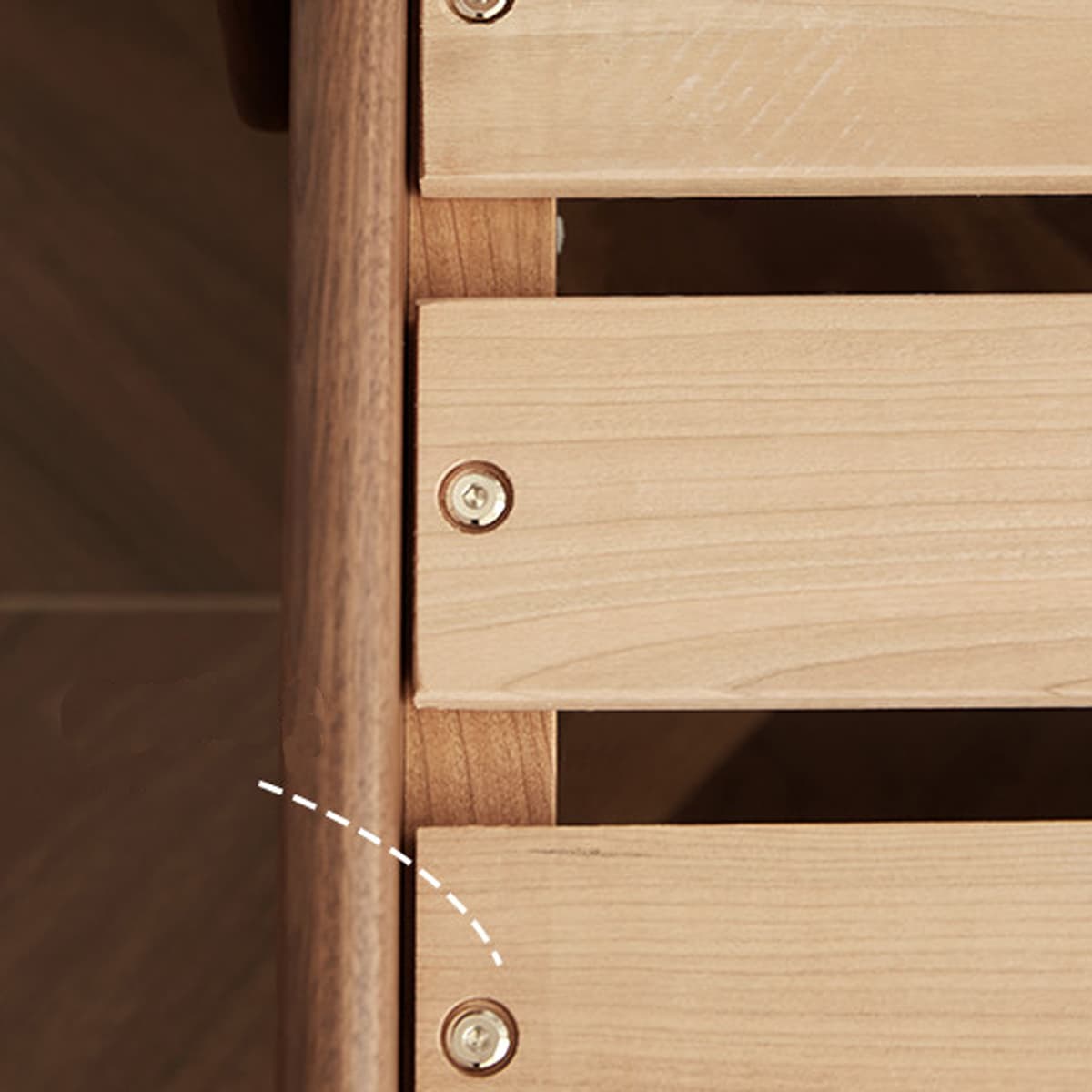 Close-up of solid wood slats with brass screws on a Walnutry heirloom-quality furniture piece