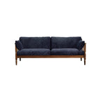 Deep navy blue cushioned sofa with wooden frame and two side pillows on white background