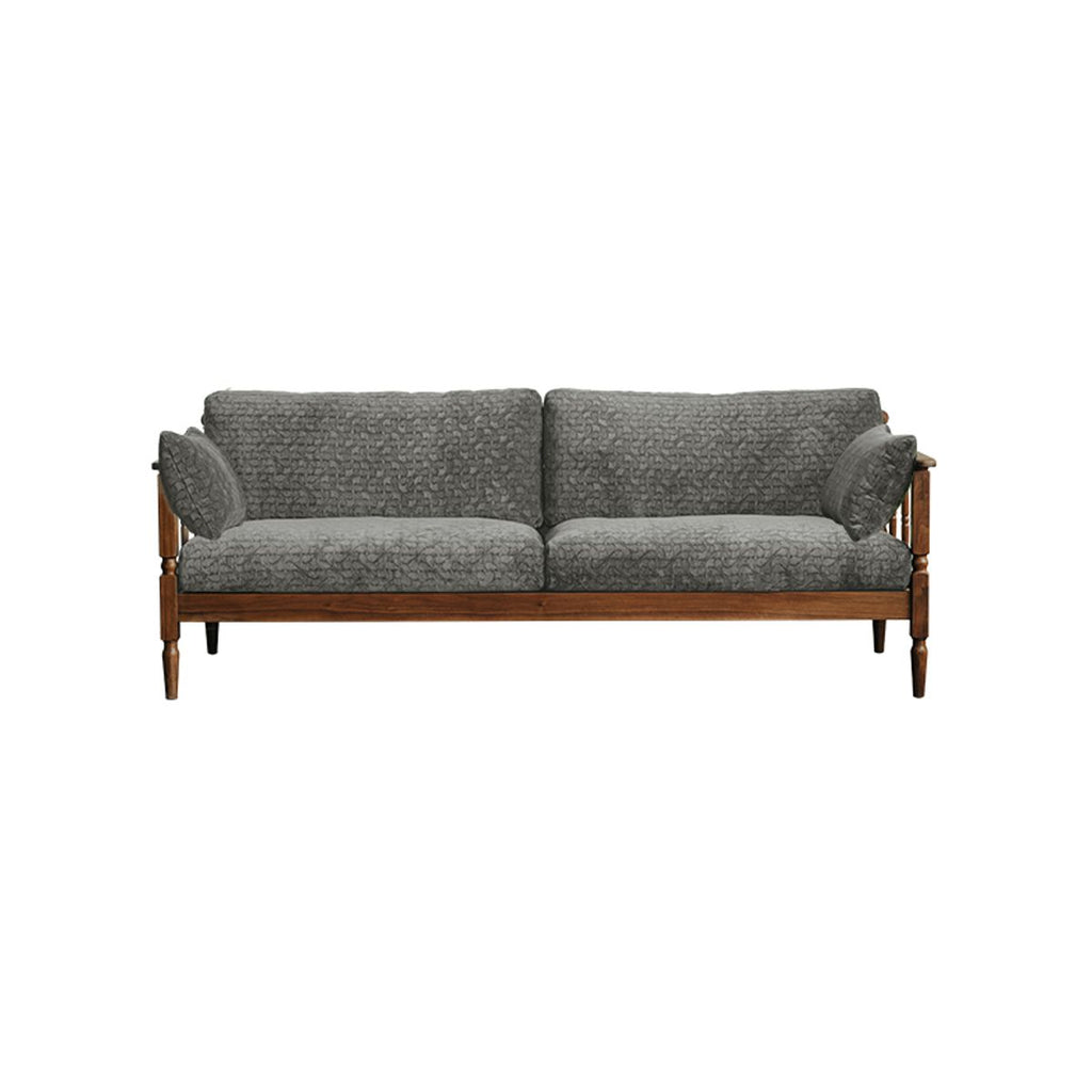Vintage grey upholstered sofa with wooden frame and two side cushions isolated on white