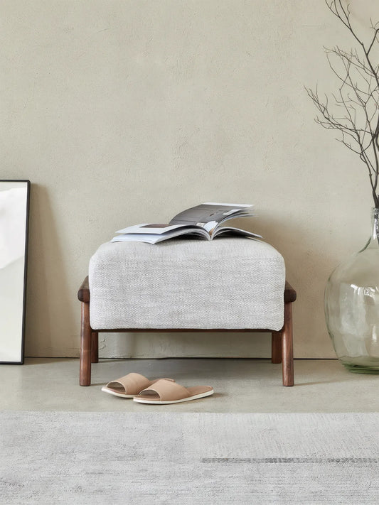 Walnutry Heritage Footstool front view, compact wood footstool with soft cream upholstery and warm wooden legs