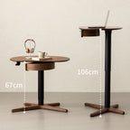 Adjustable height walnut side table with black base, shown at 67cm and 106cm heights with laptop and headphones