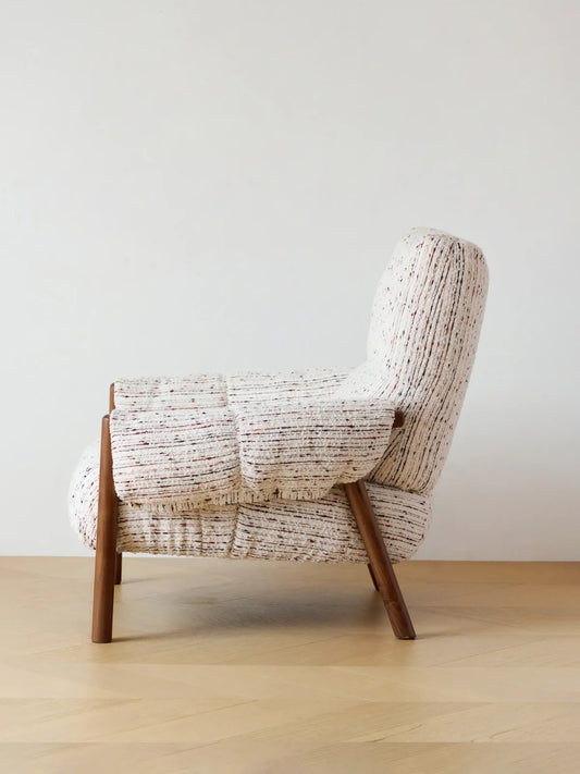 Walnutry Marais Armchair side profile, high back accent armchair with supportive recline, upholstered body, and angled walnut wood legs