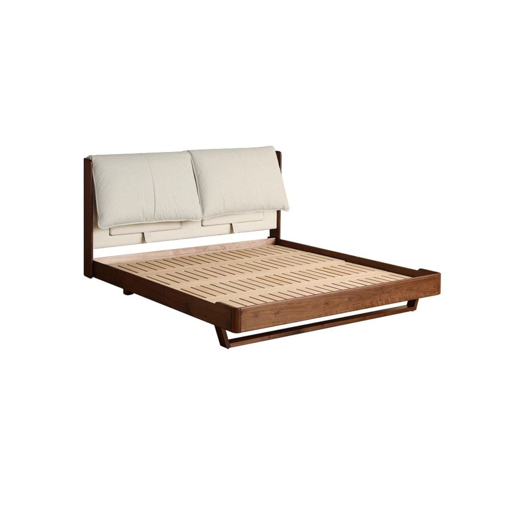 Modern wooden bed frame with slatted base and white cushioned headboard pillows