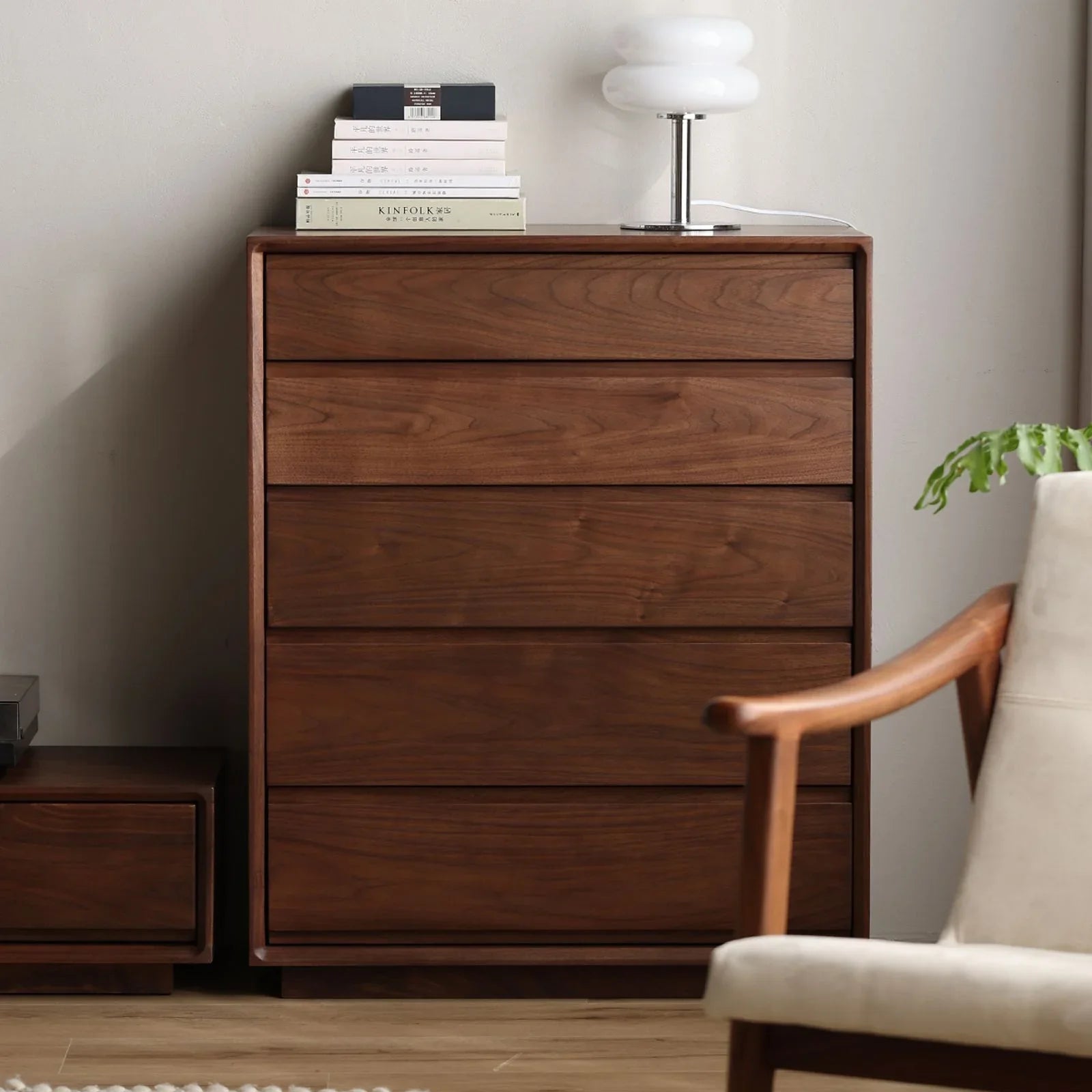 Solid North American Black Walnut bedroom chest with five drawers, styled with books and a white lamp