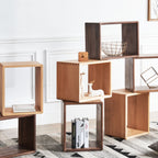 Modern wooden cube shelving units with decorative items and books in a bright living room