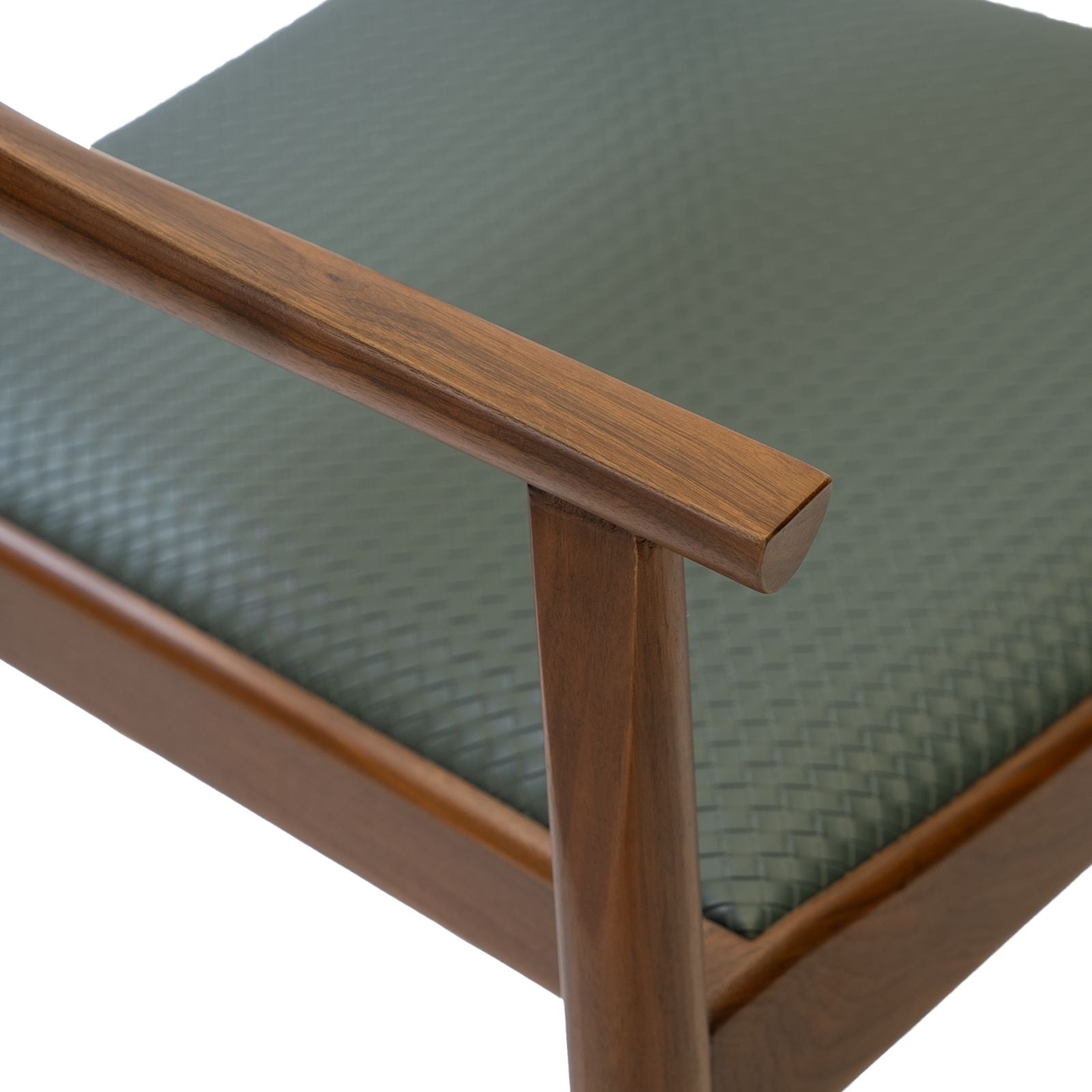 Close-up of wooden armrest and green textured cushion on mid-century modern chair