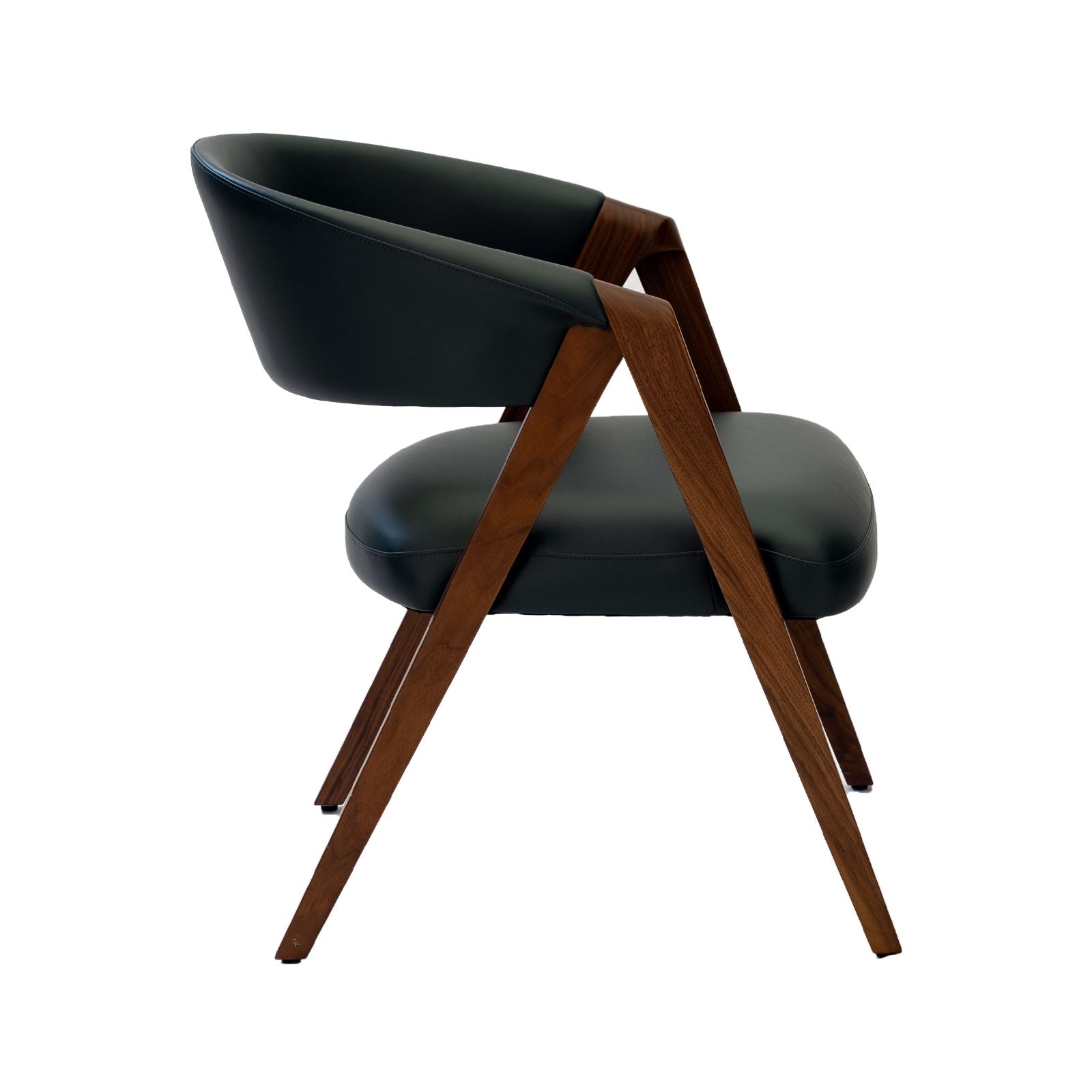 Modern black leather chair with angled wooden legs and curved backrest, isolated on white