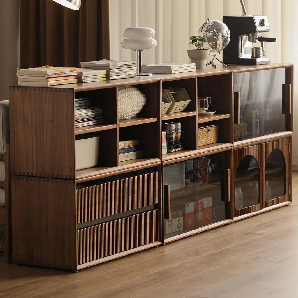 modern wooden shelving unit with books, lamp, globe, coffee machine, and storage compartments