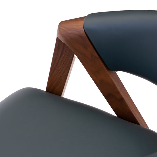 Close-up of modern chair with dark wood frame and dark gray leather upholstery