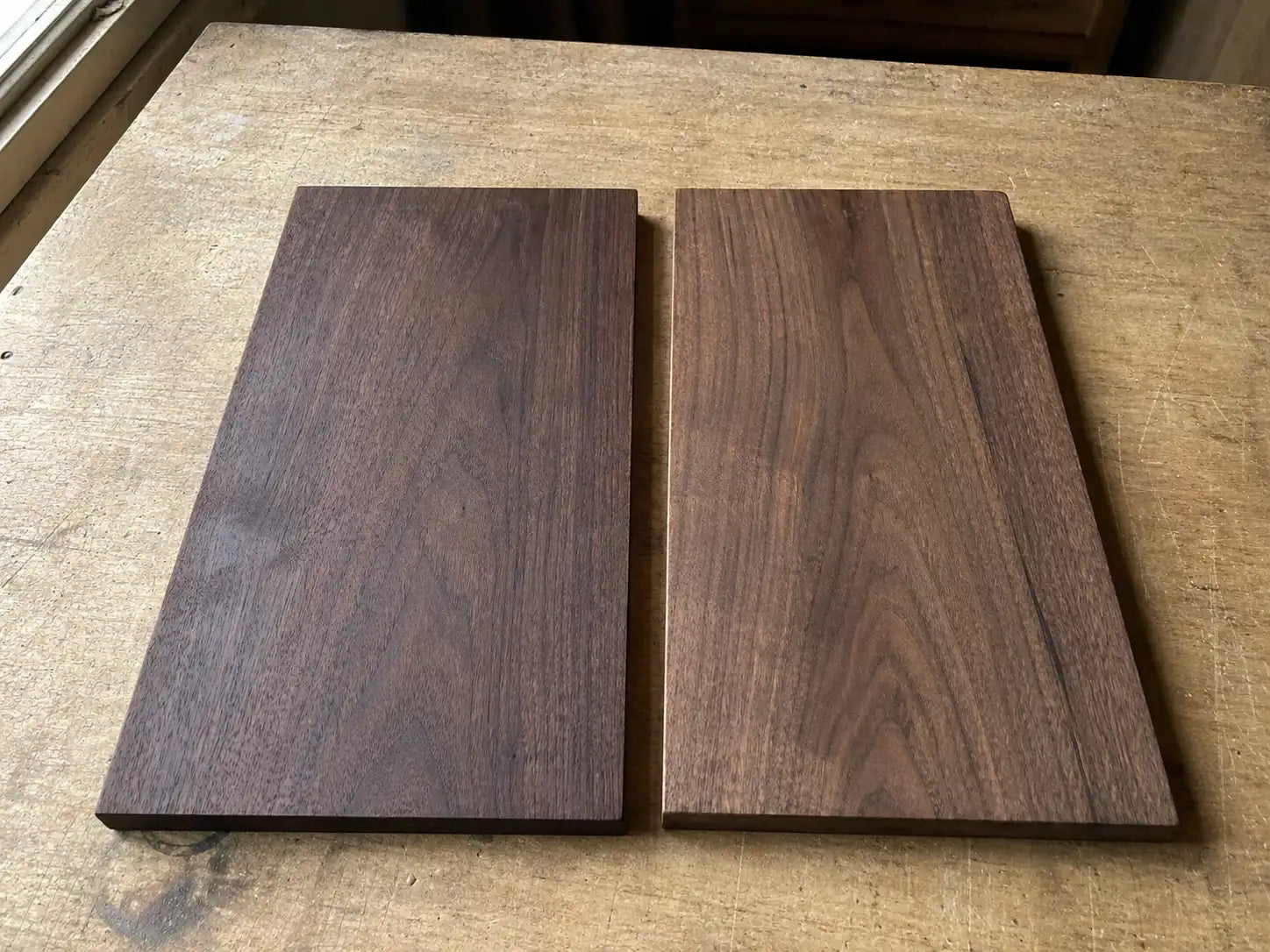 Black walnut board at year zero (espresso color) compared to year five (honey-amber color) after natural light exposure	