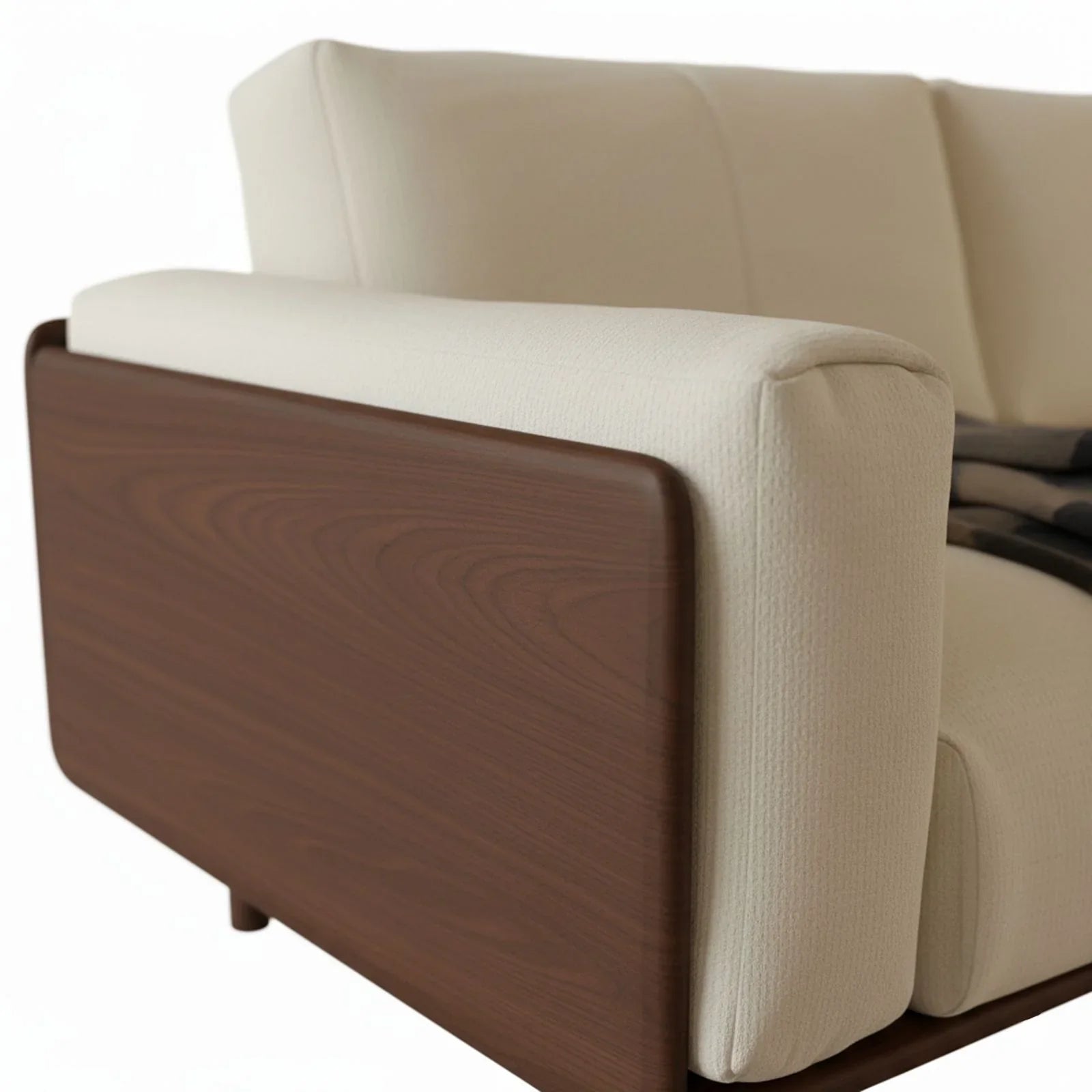 Close-up of the handcrafted solid walnut wood frame and mortise and tenon joinery on the sofa arm.