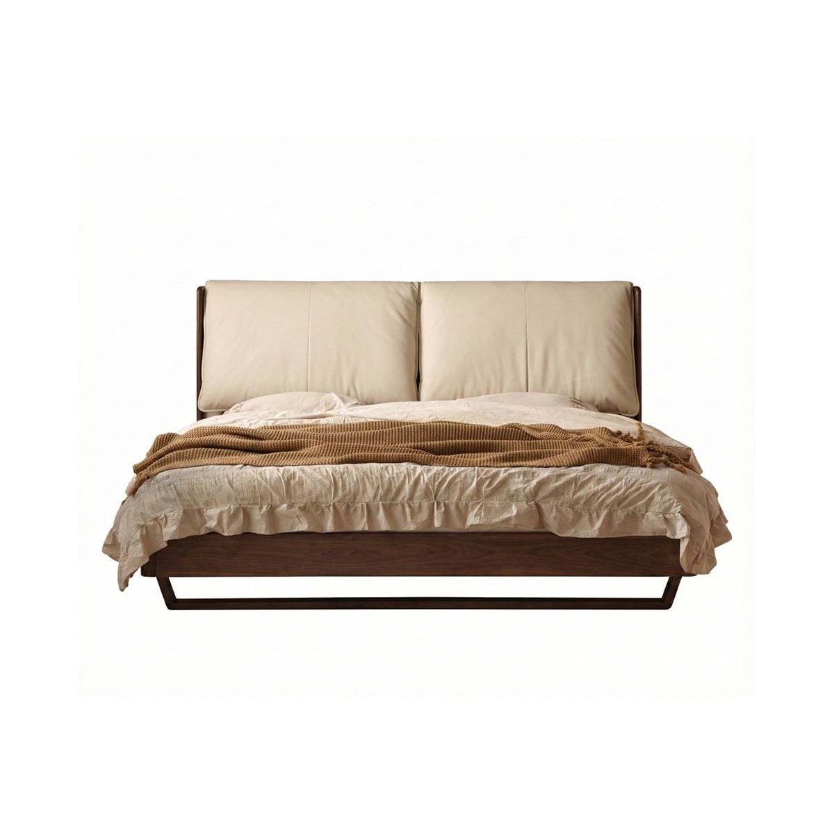 Walnutry Nimbus solid walnut floating bed with a cream top-grain leather down-filled headboard.