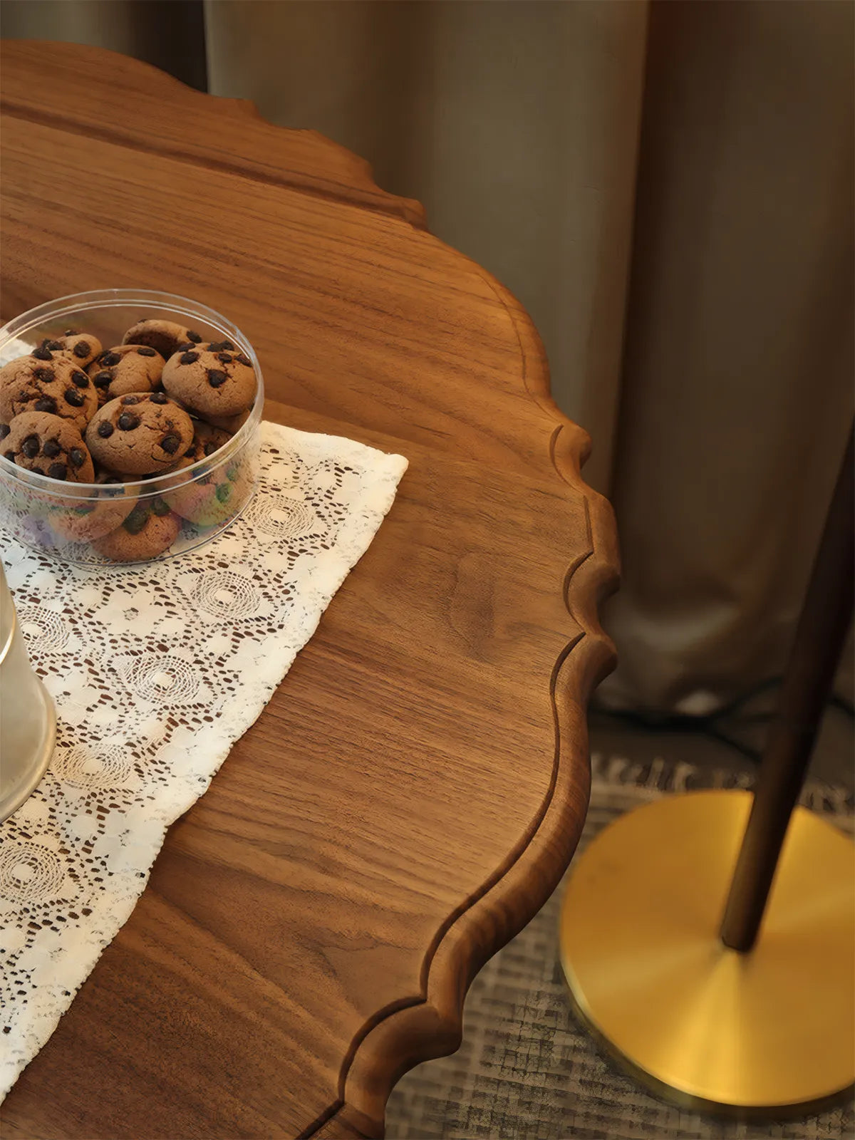 Extreme close-up of the hand-carved scalloped edge profile showing the tactile quality of the solid wood.