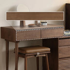 Modern walnut bedside table with integrated drawers and cushioned wooden stool