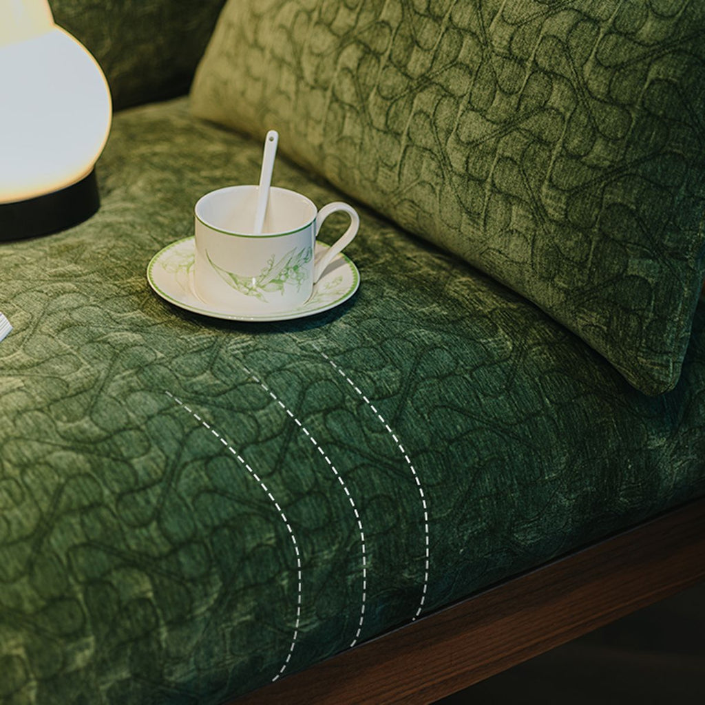 Texture shot of the four-leaf clover jacquard chenille fabric on the vintage style sofa.