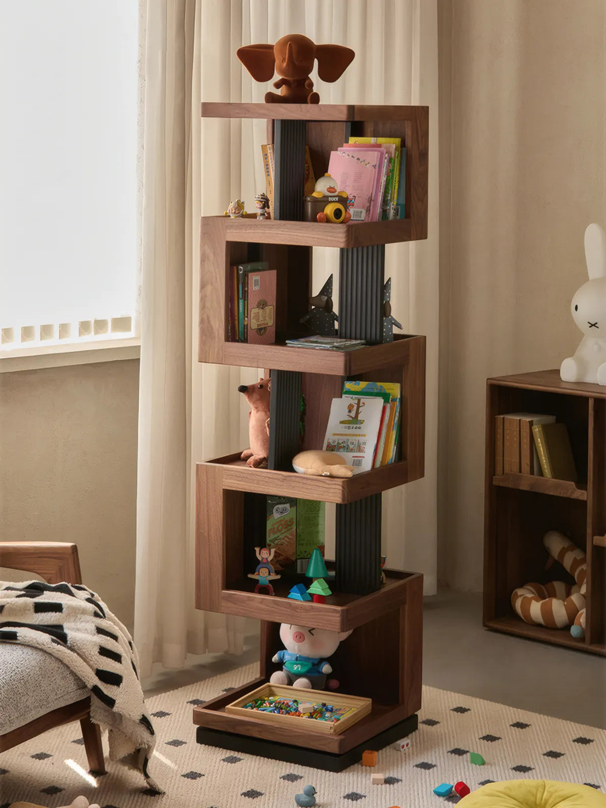 Walnutry rotating bookshelf used in a nursery, filled with children's books and wooden toys, showing versatility.