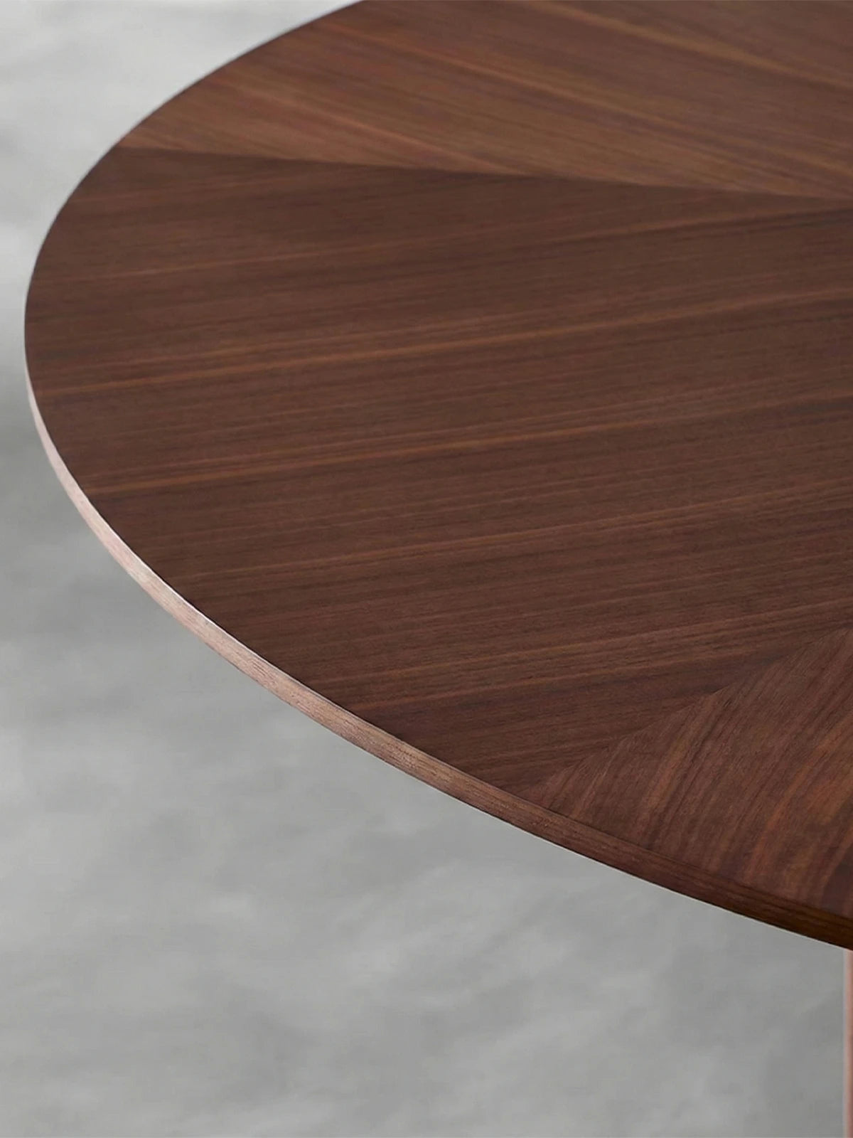 Walnutry Kurumi 60 inch solid North American black walnut round dining table featuring architectural fluted pedestal base and brass accents in a Japandi dining room.

