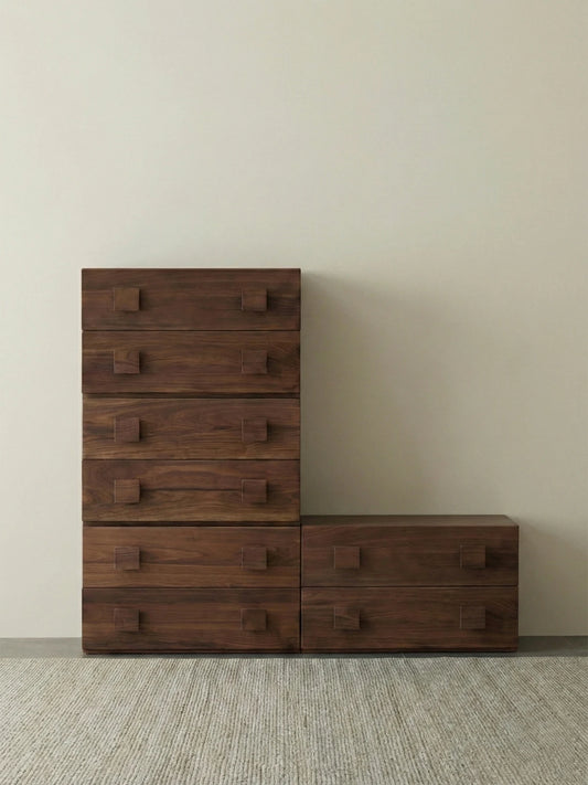 Creative L-shaped configuration of Walnutry modular drawers, demonstrating the stackable wood nightstand system's versatility.