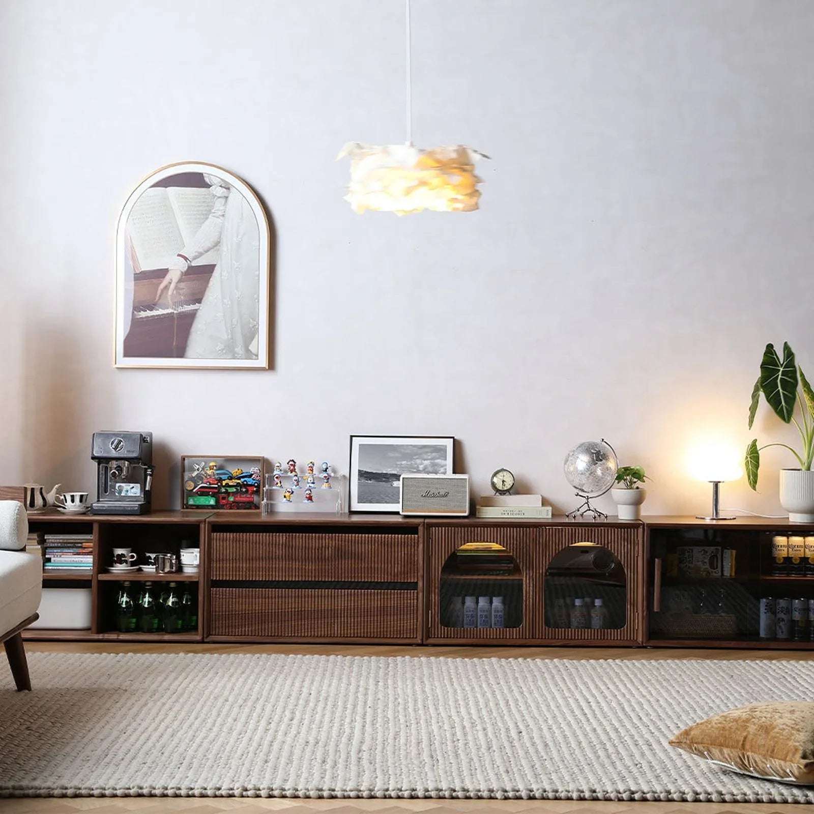 Four walnut modules arranged horizontally to create a long, modern low-profile TV stand.