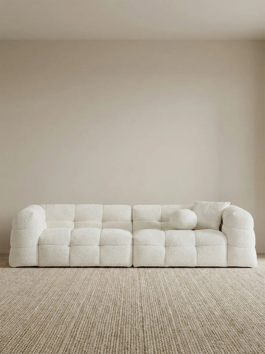 4-seater straight layout of the Cumberland sofa in white bouclé, showcasing the seamless connection between modules.