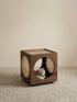 Minimalist studio shot of the Walnutry Sylvan cat side table on a neutral background