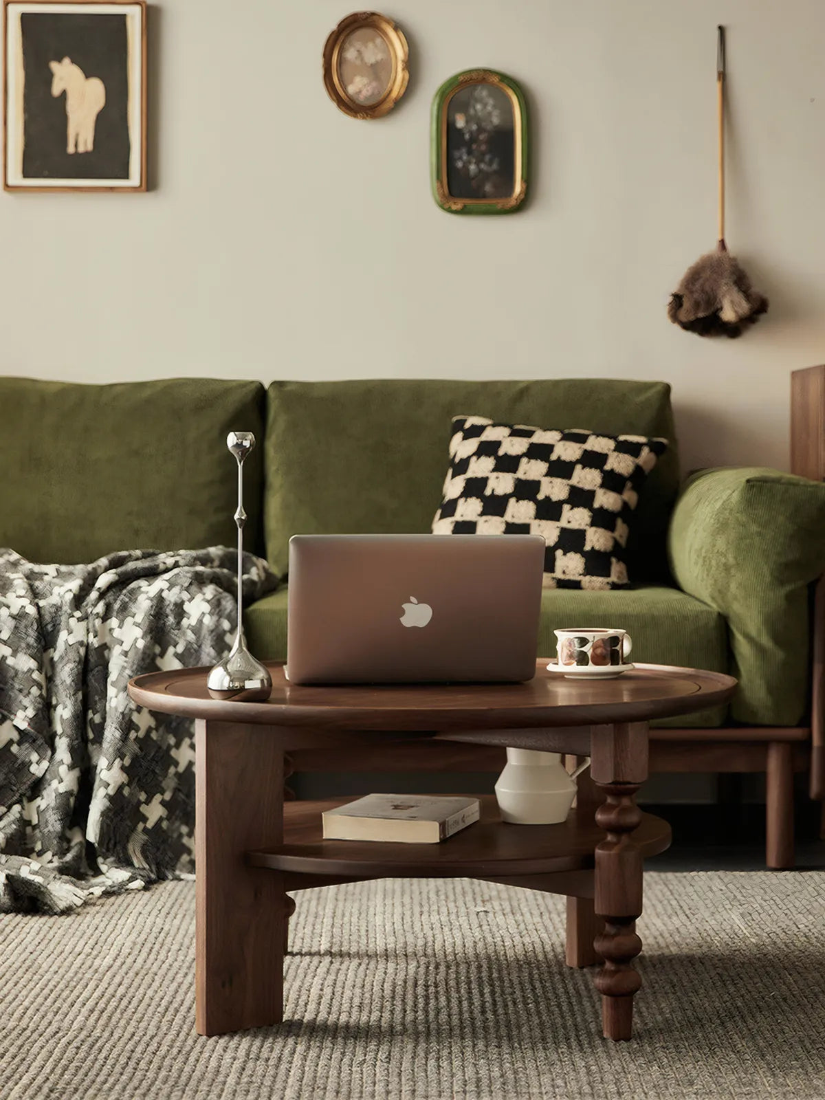 Mid-century modern living room styling with a green velvet sofa and Walnutry Sylvan solid walnut round coffee table.