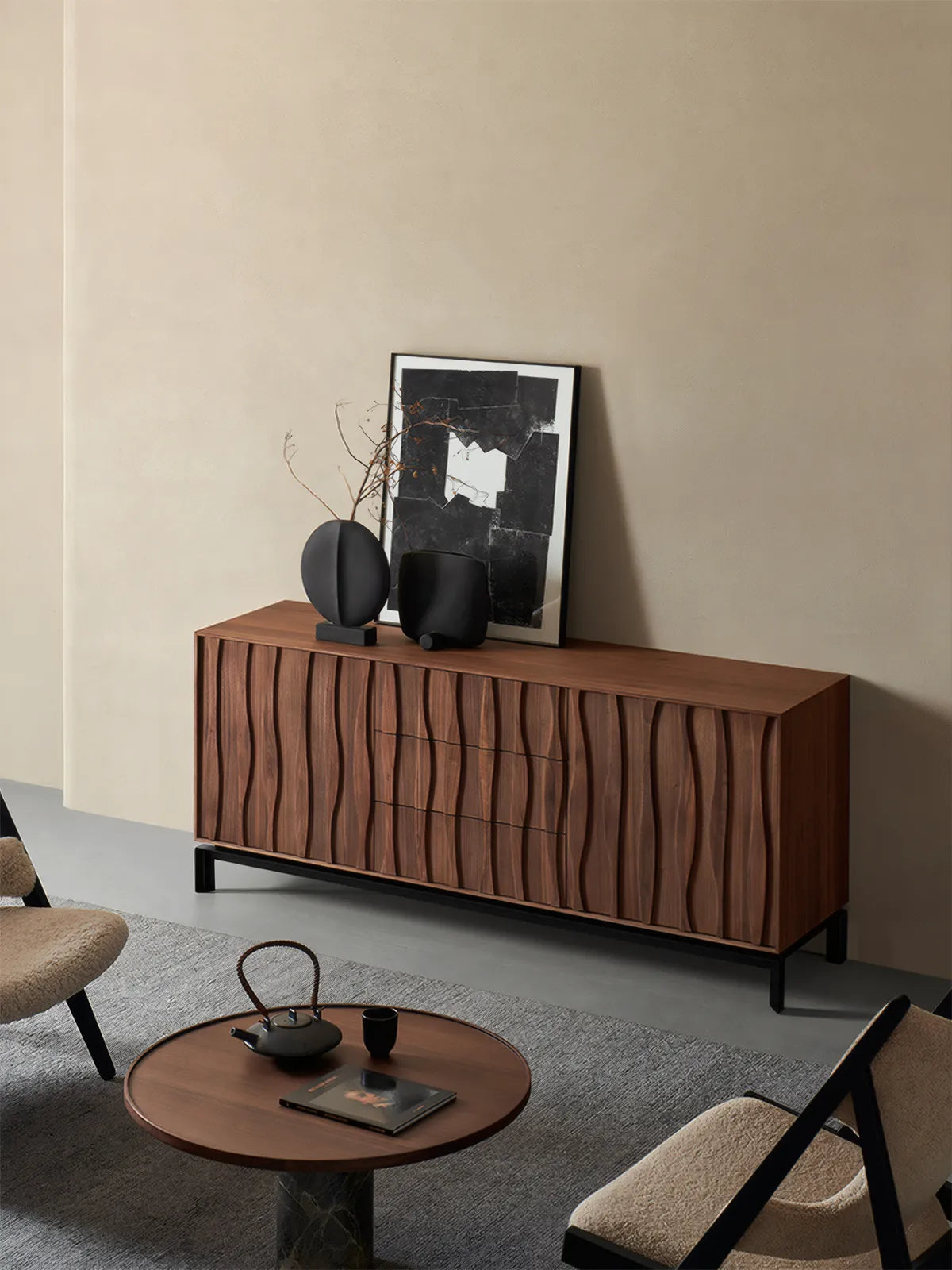 Suiseki walnut buffet cabinet placed in a modern living room setting with a round coffee table and lounge chairs, demonstrating organic modern interior design.