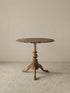 Studio shot of the Margaux table on a neutral background highlighting the silhouette and scallop details.