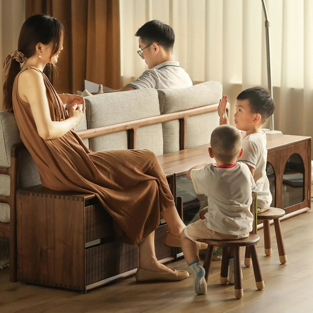 Modern walnut modular storage system integrated with sofa in a cozy family living room