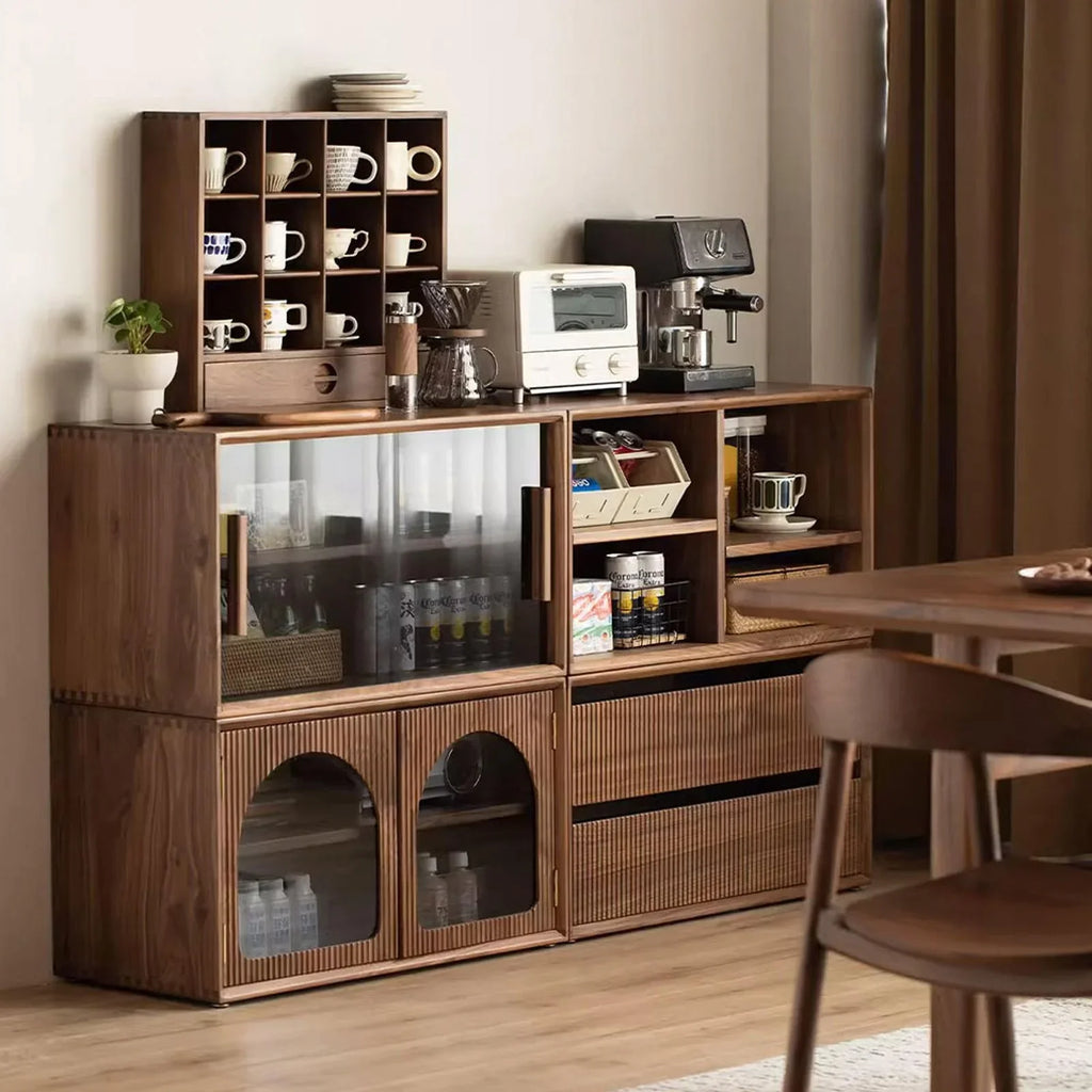 Modular walnut storage system with coffee mugs, toaster oven, espresso machine, and glass-front cabinets