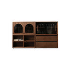 Modular walnut storage system with glass doors, open shelves, and drawers in modern design