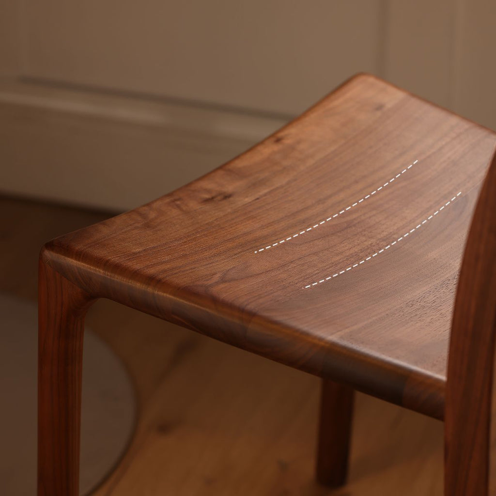 Close-up of the nail-free mortise and tenon joinery on the solid wood dining chair.