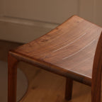 Close-up of the nail-free mortise and tenon joinery on the solid wood dining chair.
