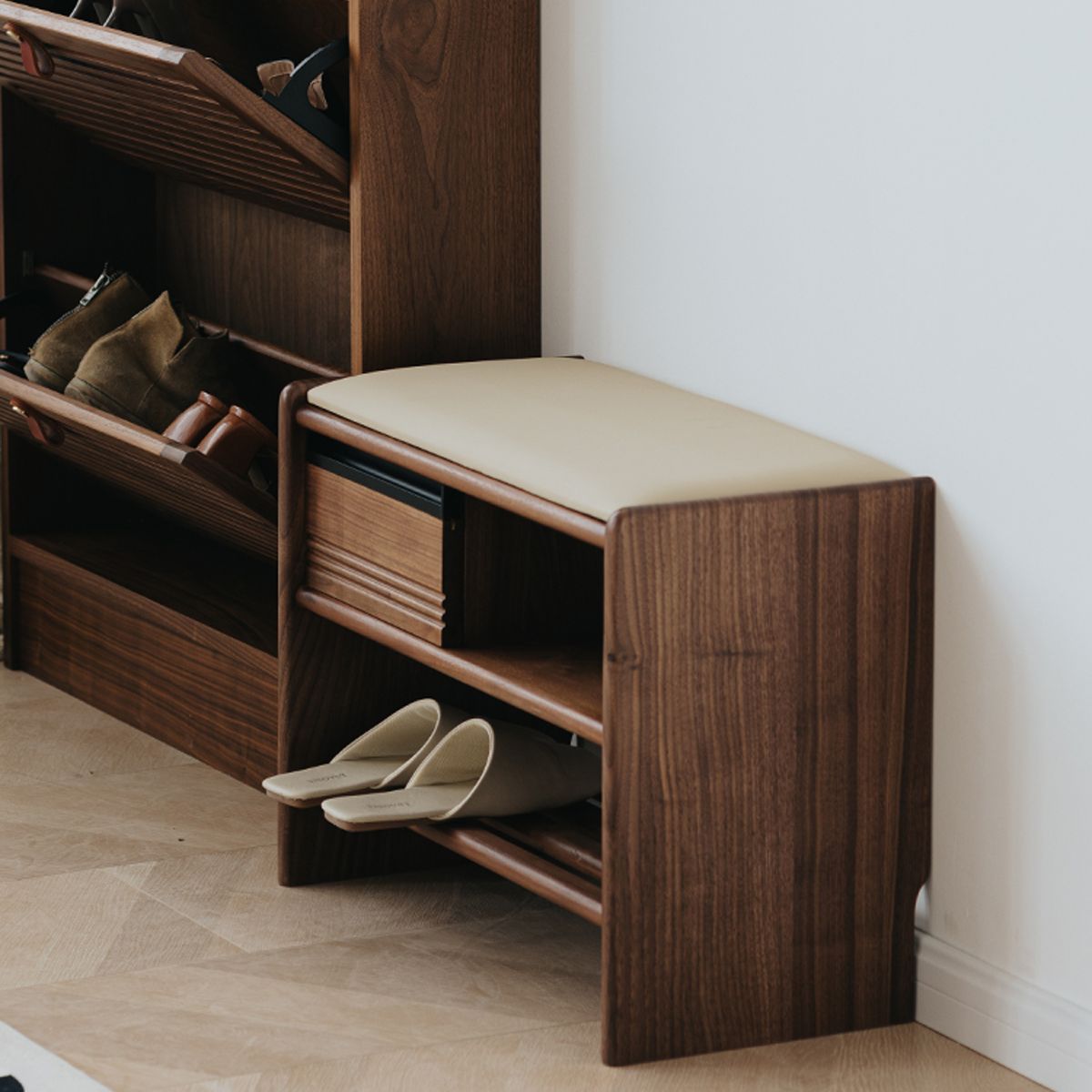 Side profile view of the compact walnut shoe bench designed for narrow hallways and small apartments with microfiber leather.